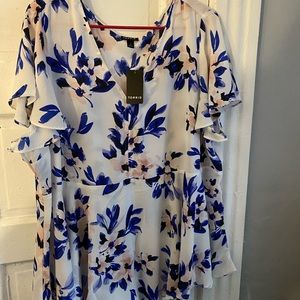 White and blue floral peplum blouse
